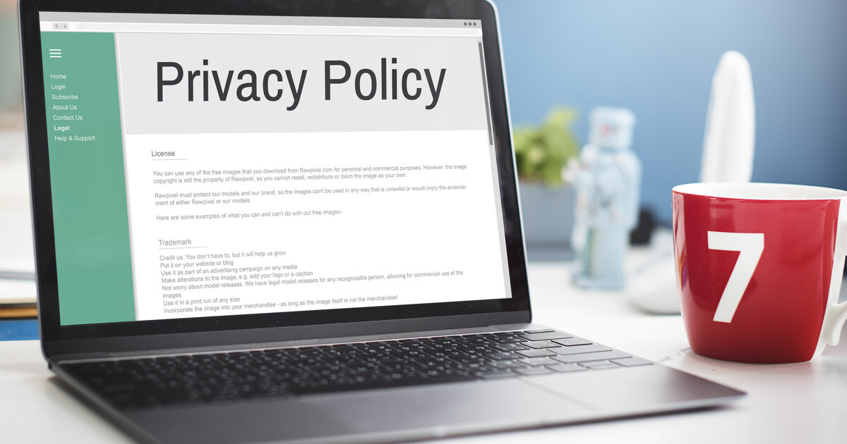 Laptop showing a website privacy policy page for consent mode compliance